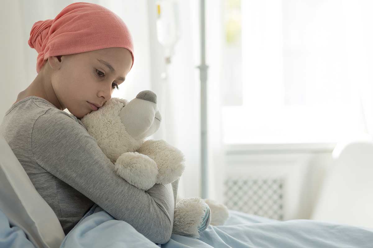 A child laying in a hospital bed